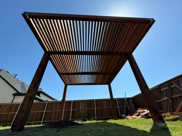 Modern cedar pergola over a backyard seating area